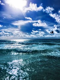 Scenic view of sea against cloudy sky