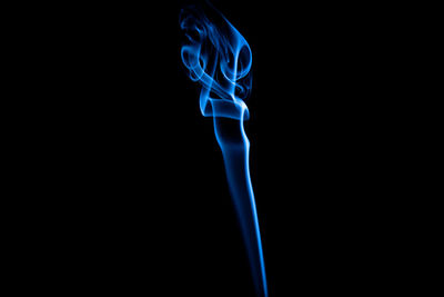 Close-up of light painting against black background