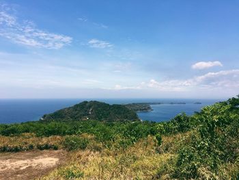 Scenic view of sea against cloudy sky