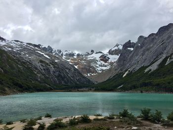 Scenic view of lake and mountains against sky