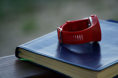 Close-up of red book on table