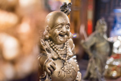 Close-up of buddha statue at temple