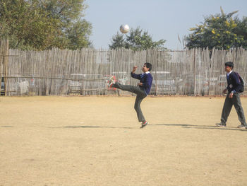 Man playing with ball on field