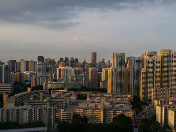 Cityscape against cloudy sky