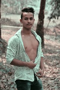 Portrait of young man standing outdoors