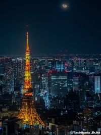 Illuminated buildings in city at night