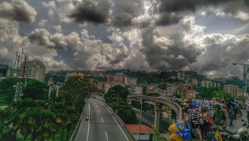 Panoramic view of road in city against sky