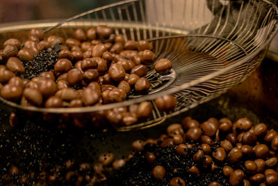Close-up of chestnut roasting in container