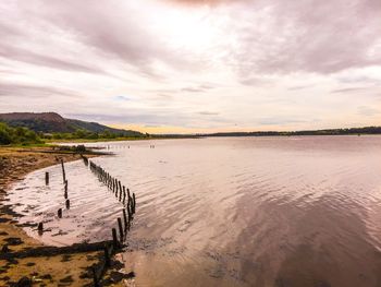 Scenic view of calm lake against sky