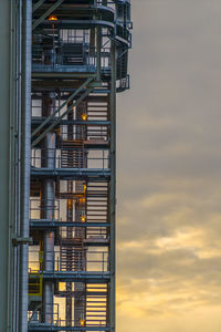 Low angle view of building against sky during sunset