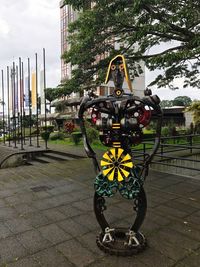 Bicycles in park against sky