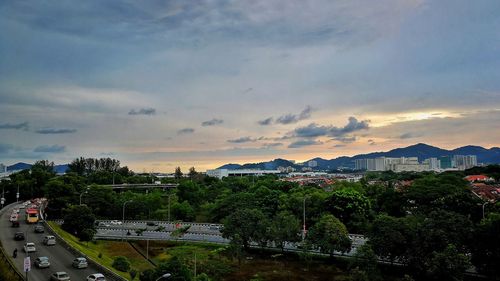 High angle view of city against sky at sunset