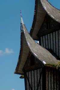 Low angle view of building against blue sky