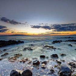 Scenic view of sea at sunset