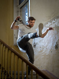 Low angle view of man climbing on staircase