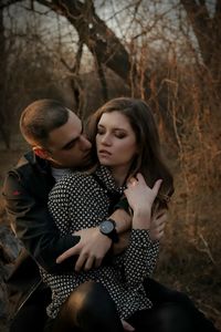 Young couple romancing in forest