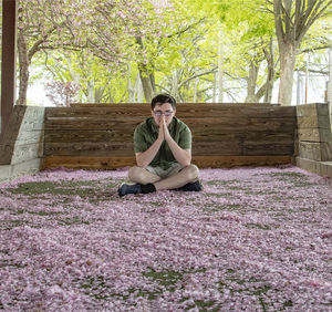 Young woman sitting on field