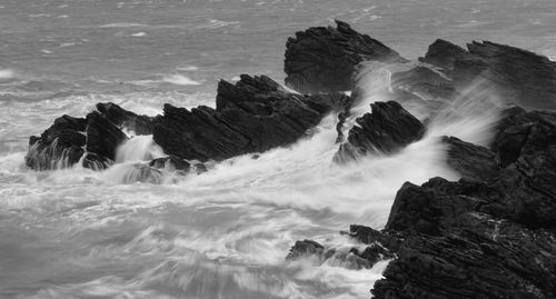 Waves splashing on rocks