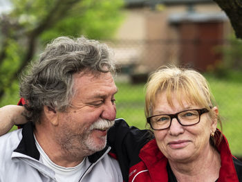 Close-up portrait of couple in park