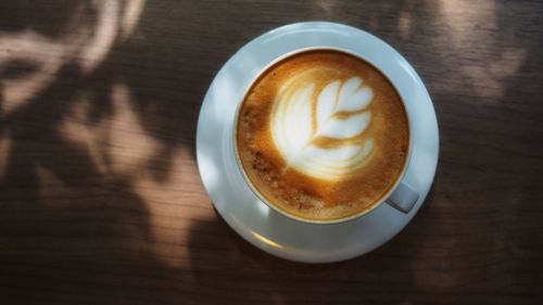 High angle view of cappuccino on table