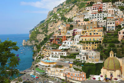 High angle view of townscape by sea