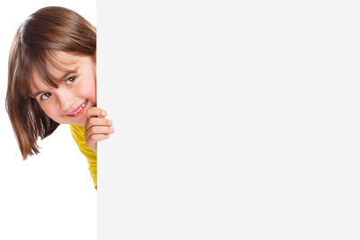 Portrait of a smiling young woman over white background