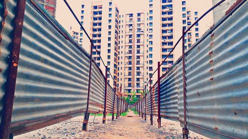 Low angle view of buildings in city against sky