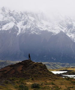 Man standing on snowcapped mountain