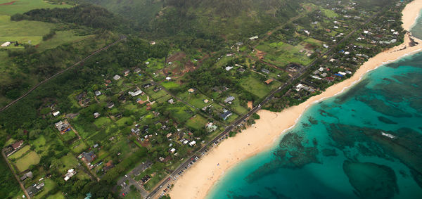 Aerial view of sea and green landscape