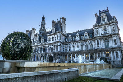 Low angle view of buildings against clear sky