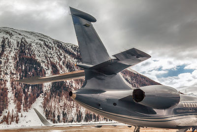 Tail of a private jet in the airport of st moritz switzerland in winter