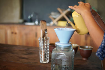 Close-up of drink in glass jar on table