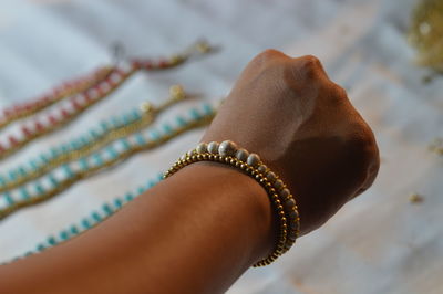 Close-up of person hand wearing bracelet