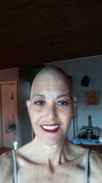 Portrait of a smiling young woman at home