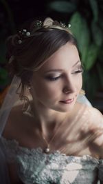 Close-up of young bride looking away