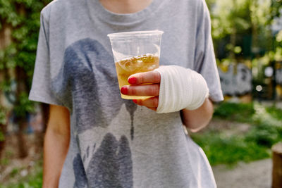 Midsection of woman holding ice cream