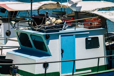 Boats moored at harbor