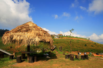 Built structure on field against sky