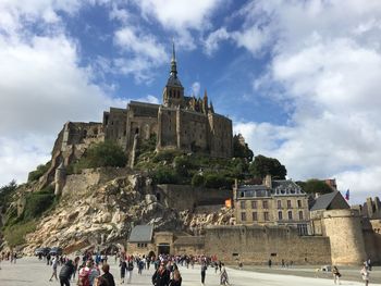 Group of people in front of historic building