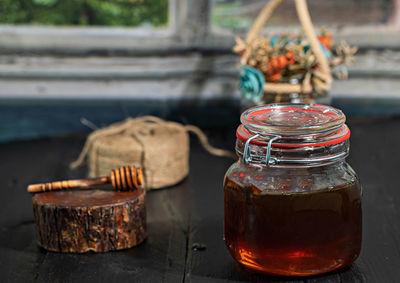 Close-up of drink in glass jar on table