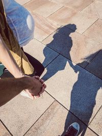 Low section of people on tiled floor