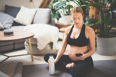 Young woman doing yoga at home