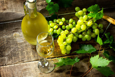 Green grapes in glass container on table