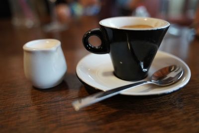 Close-up of coffee cup on table