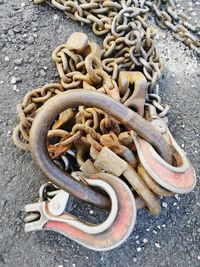 High angle view of rusty chain on street