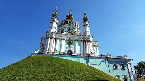 Low angle view of traditional building against clear blue sky