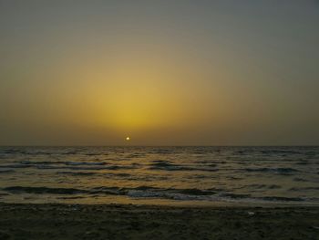 Scenic view of sea at sunset