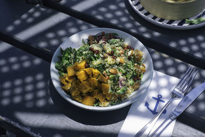 High angle view of salad in bowl on table