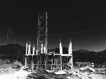 Built structure on landscape against the sky