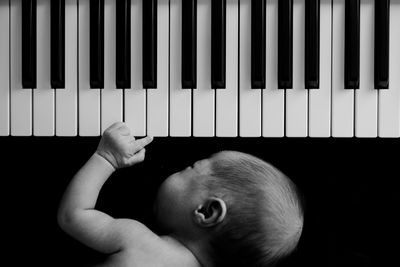 Baby sleeping by piano